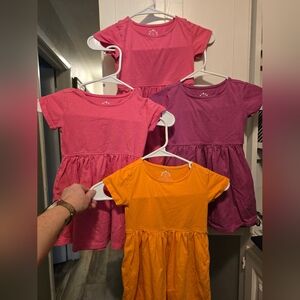Primary Kids Dresses in Pink, Purple, and Yellow